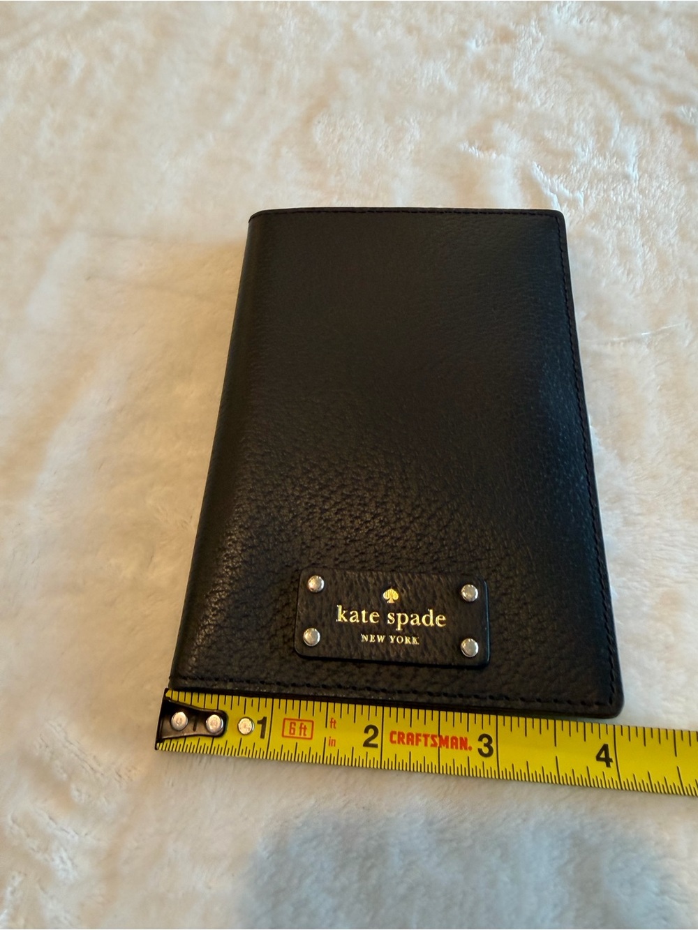 kate spade Black Pebbled Leather Travel Wallet with Gold Logo